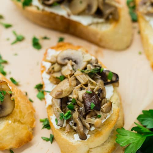 baked crostini with mushrooms and cheese served with apple salad