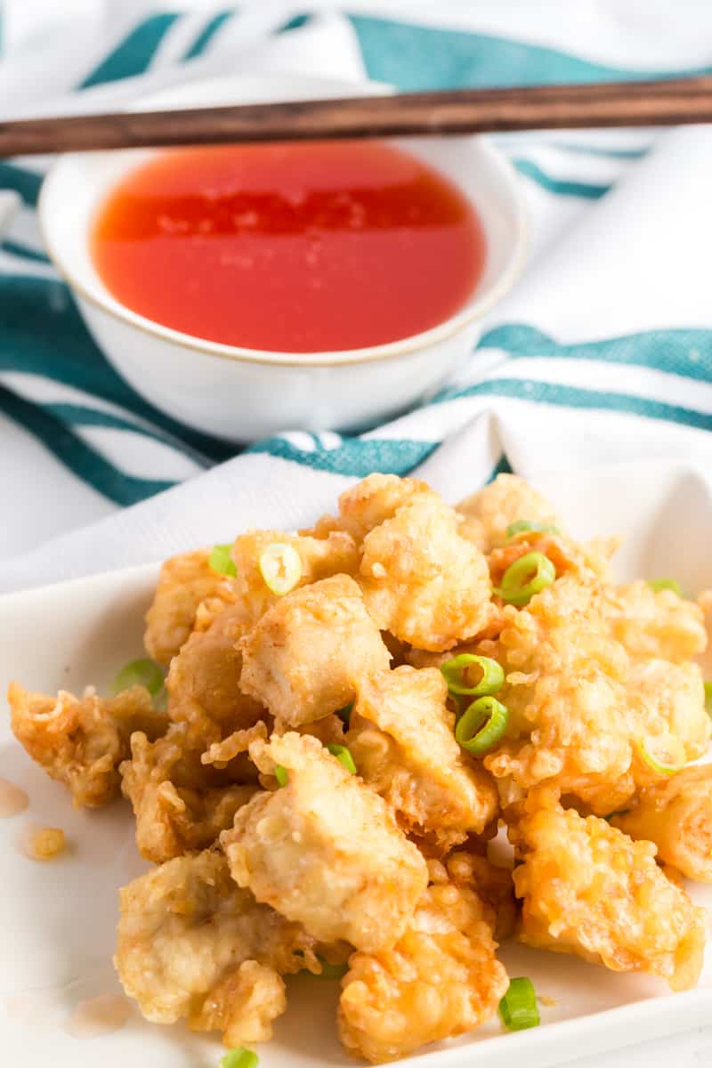 chicken fried in tempura with sweet and sour sauce