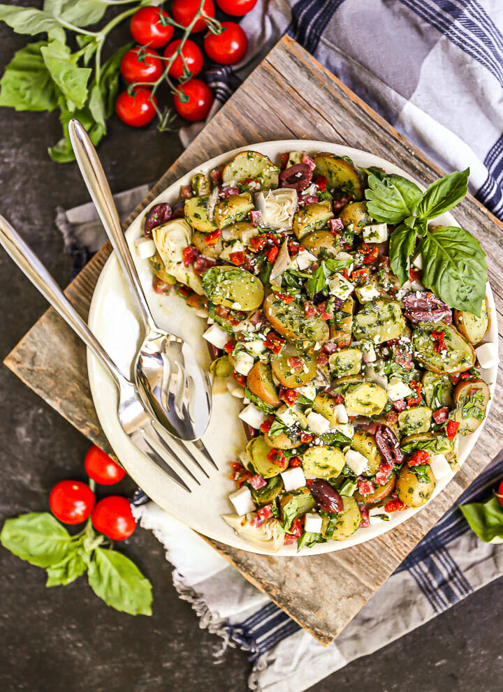 green potato salad with dried tomato and cheese ideal for summer