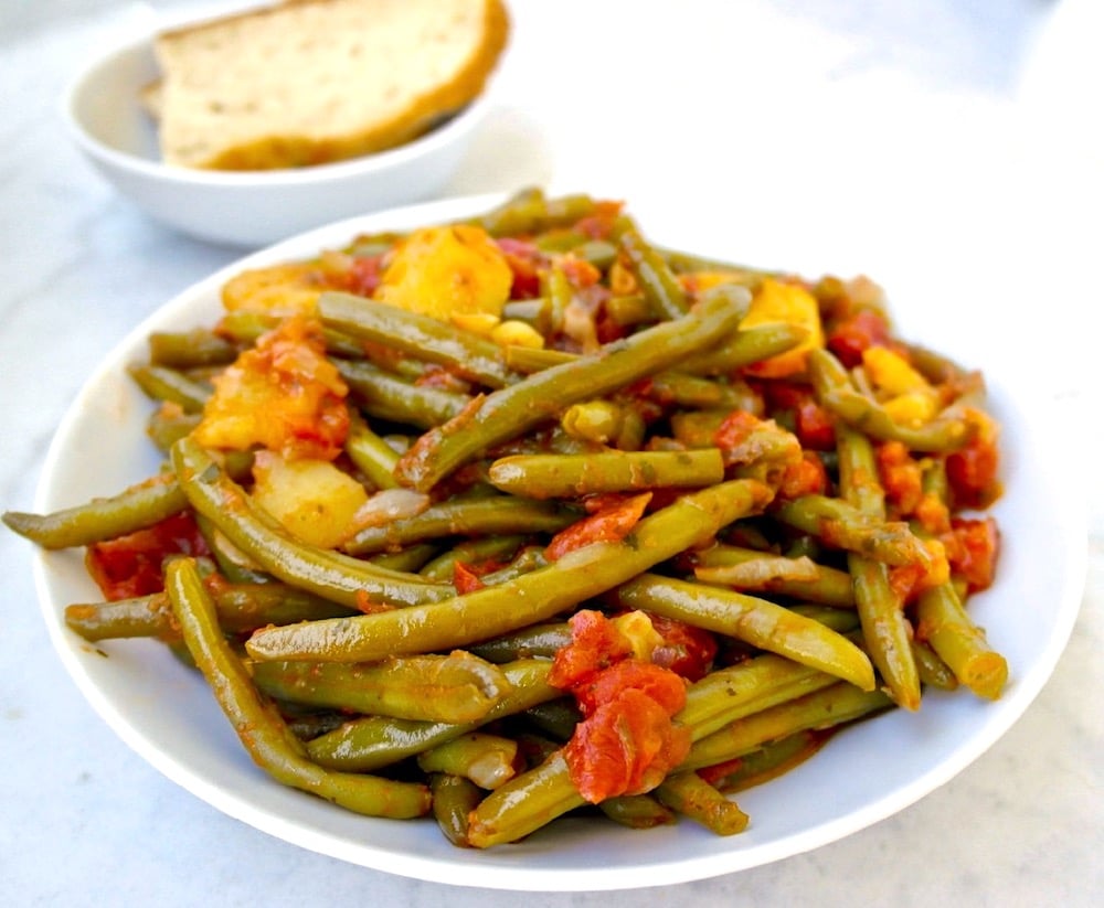 mustard lamb collars with green beans and black olives