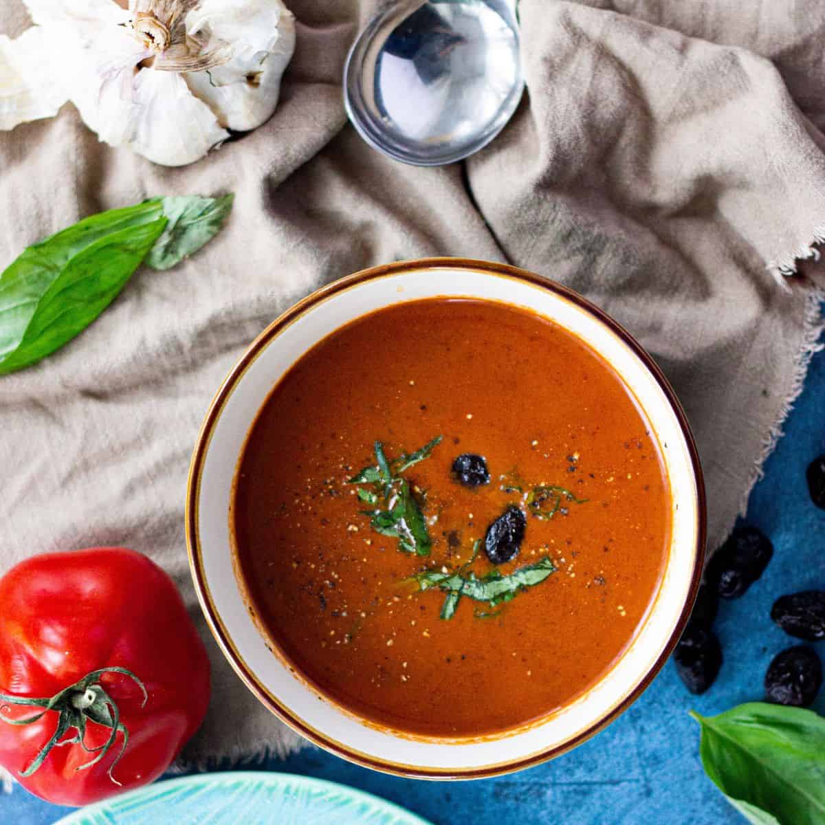 rich tomato soup with black olives