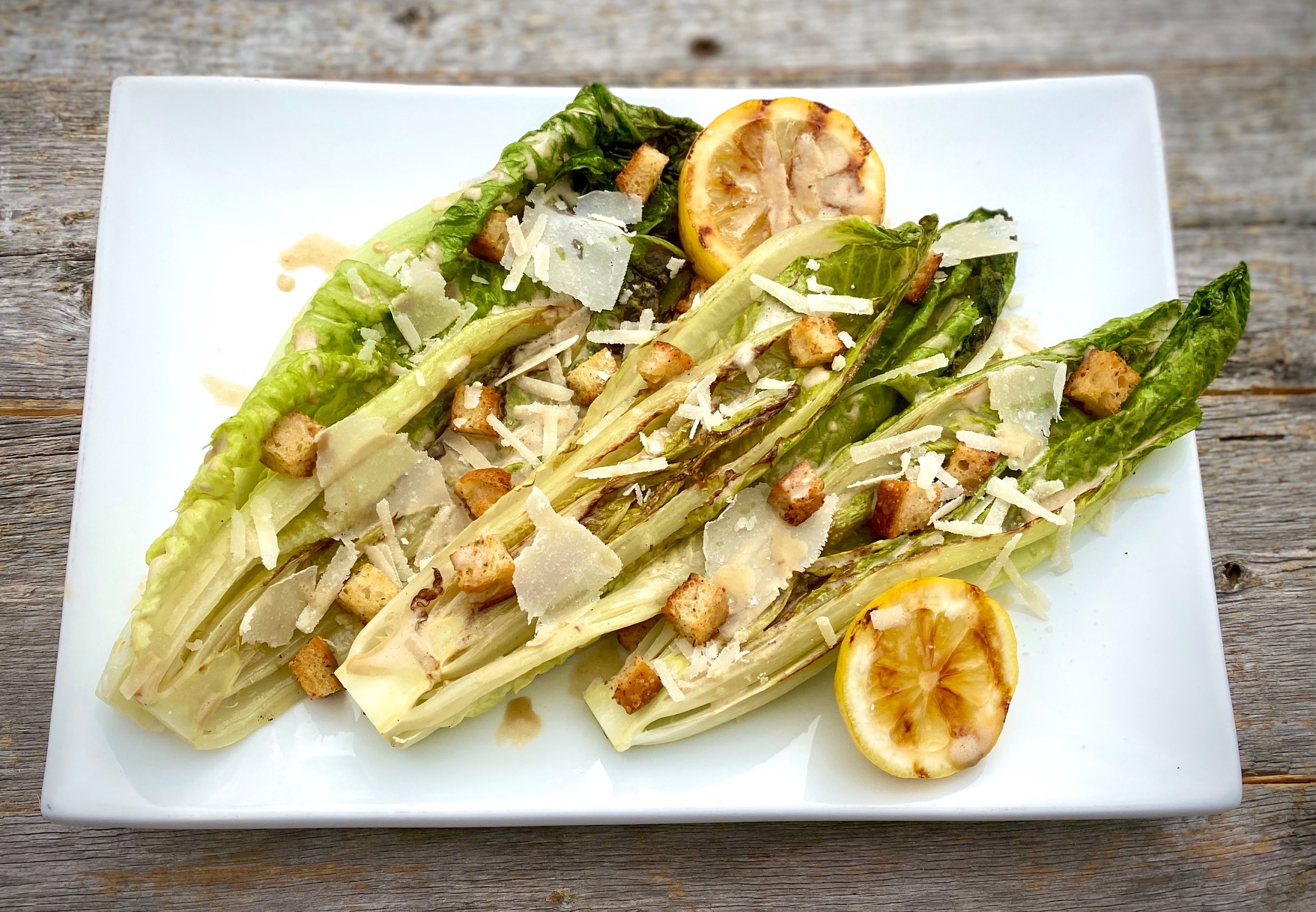 salad of roasted lettuce hearts and anchovies caesar sauce