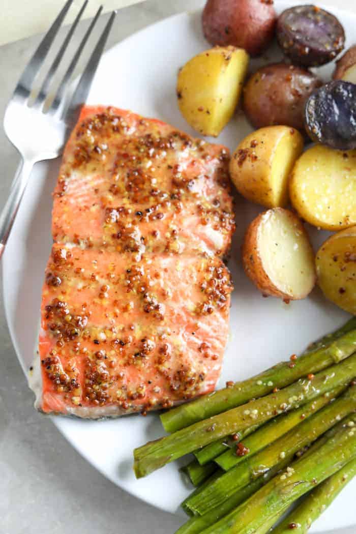 salmon on grill pan with corn and roasted potatoes