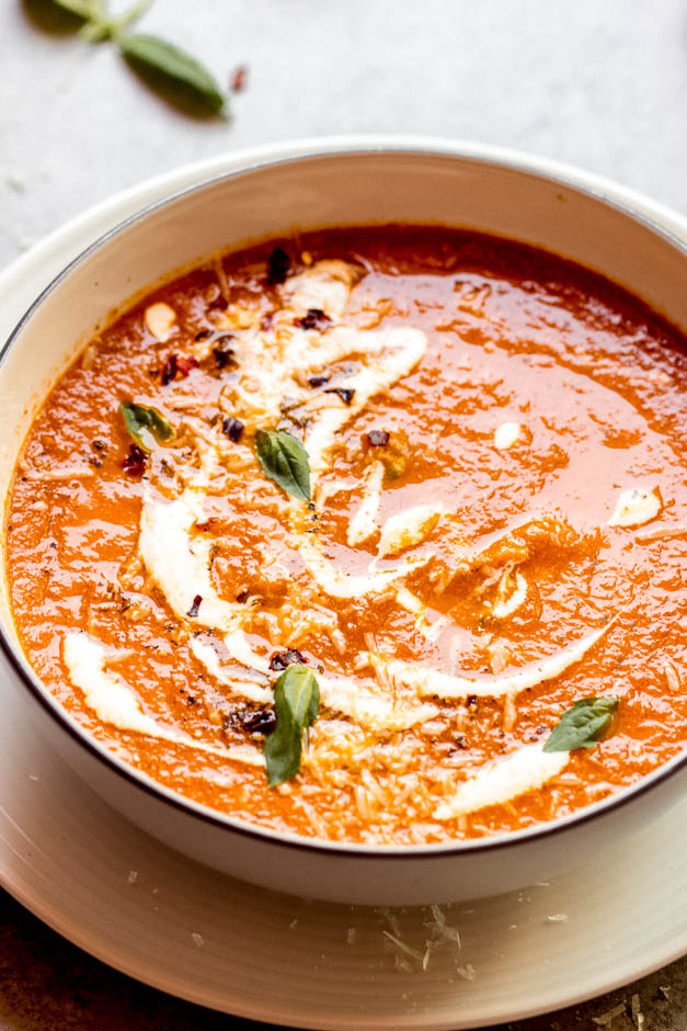 tomato soup with basil pesto and parmesan