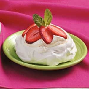 whipped cream cup with strawberries and meringues