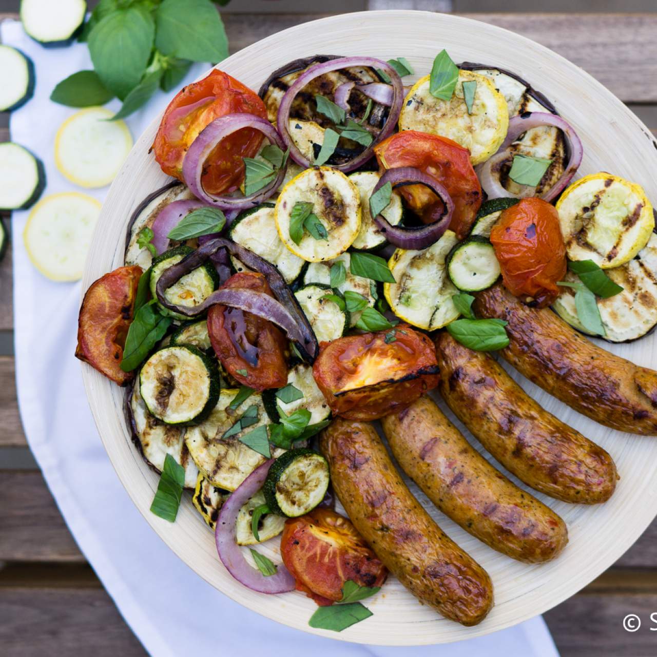 grilled chipolata with vegetable salad