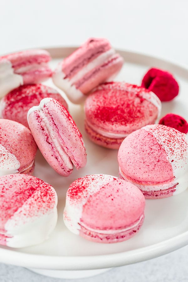 raspberry macaroons covered in white chocolate with stars