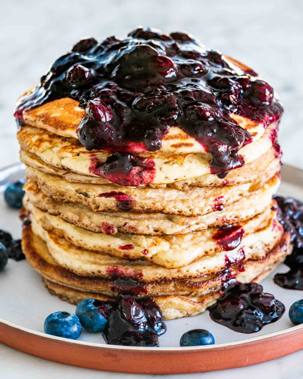 sour pancakes with blueberries and whipped cream