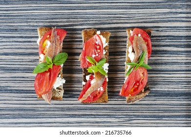 toast with tomatoes and anchovies