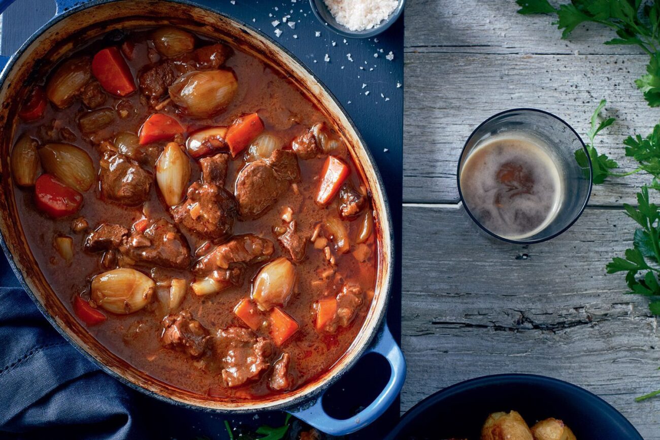 beef or pork stew recipe cooking in a slow cooker in the winter for dinner home made from scratch