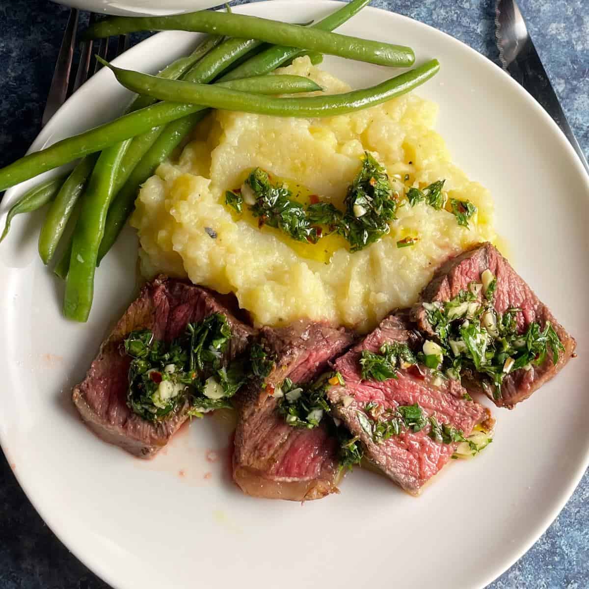 beef steak with roasted pepper salad with mint and chimichurri