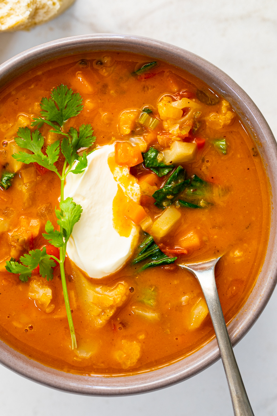 chicken broth with ginger coriander tomatoes and coconut cream