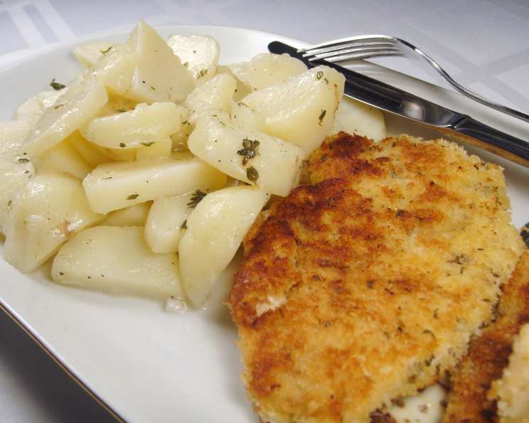 fried chicken schnitzel with potato salad