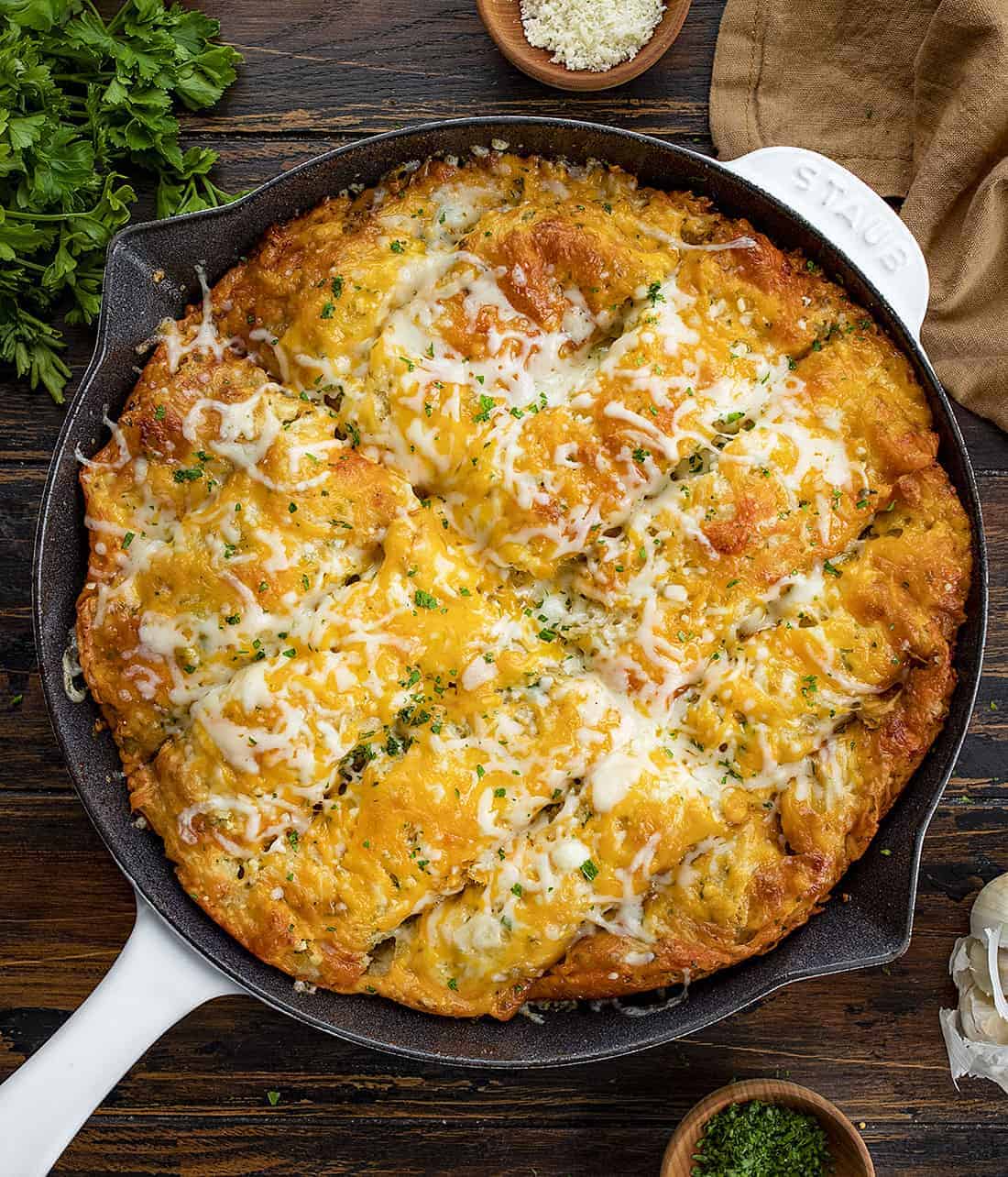 recipe layered in a cake pan with bread slices hamburger and cheese